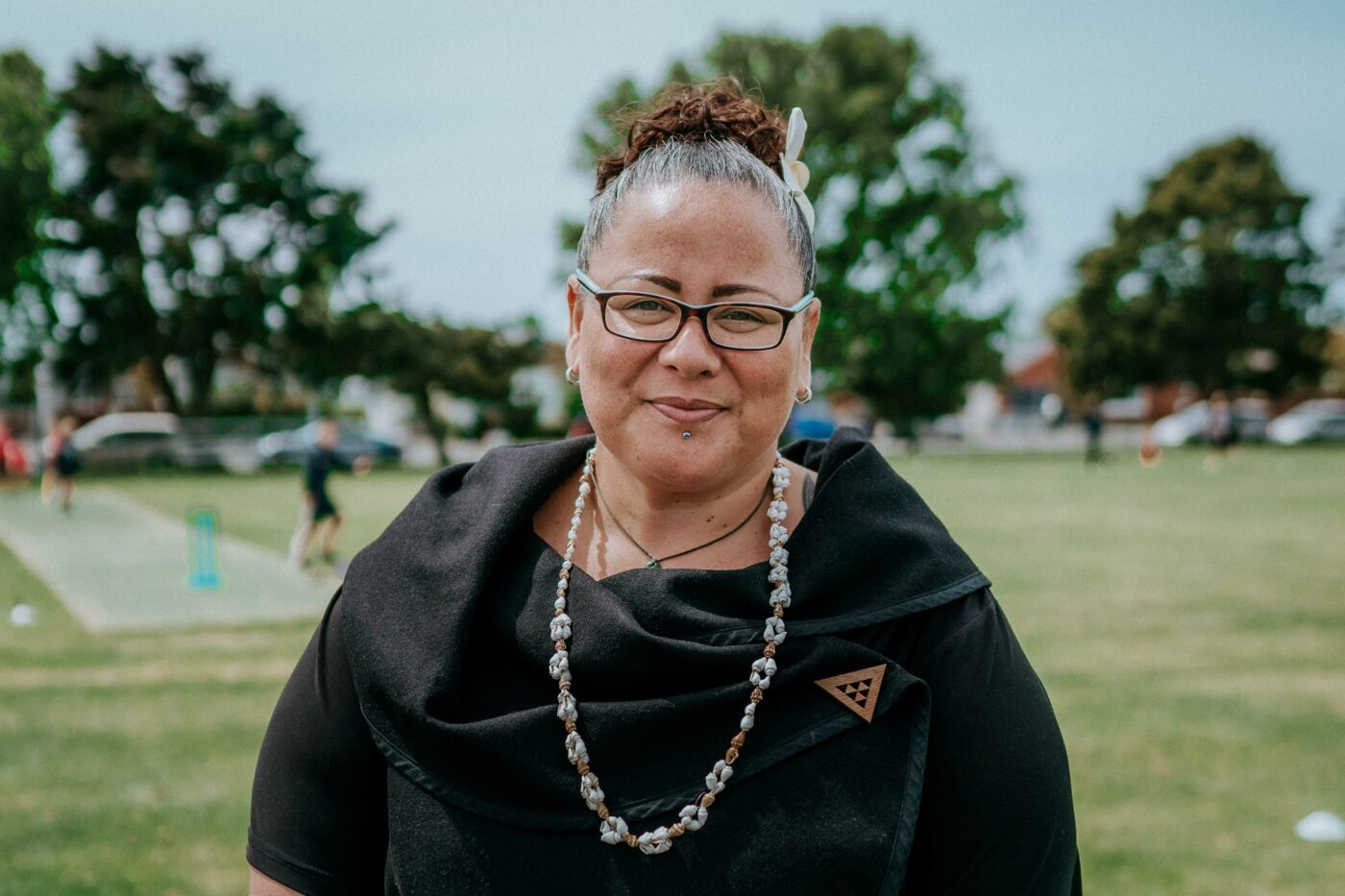 Portrait of a Māori woman looking at the camera.